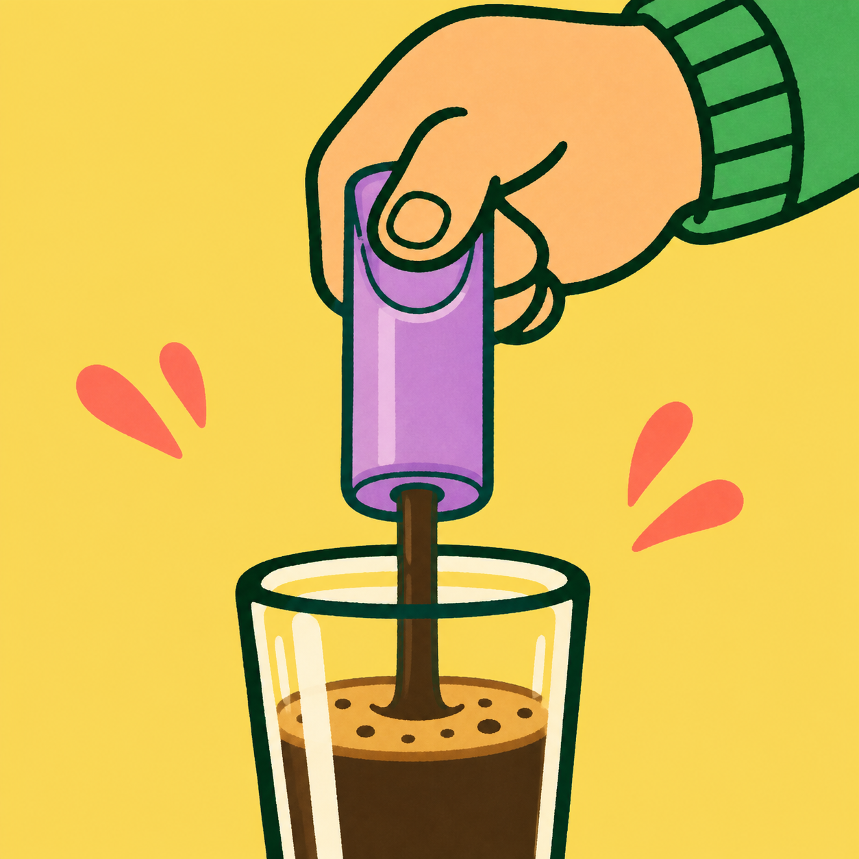 A hand pressing an @once tube to pour coffee into a glass